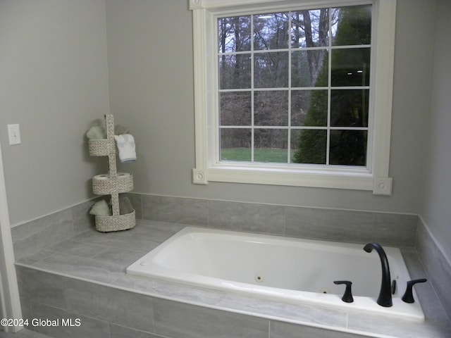 bathroom featuring tiled bath