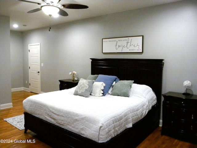 bedroom featuring dark hardwood / wood-style floors and ceiling fan