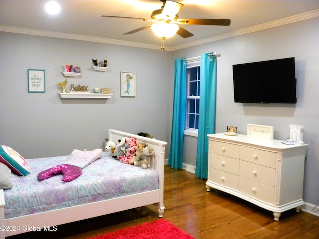 bedroom featuring ceiling fan, dark wood-type flooring, and ornamental molding