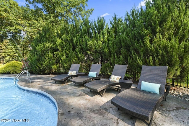 view of swimming pool featuring a patio