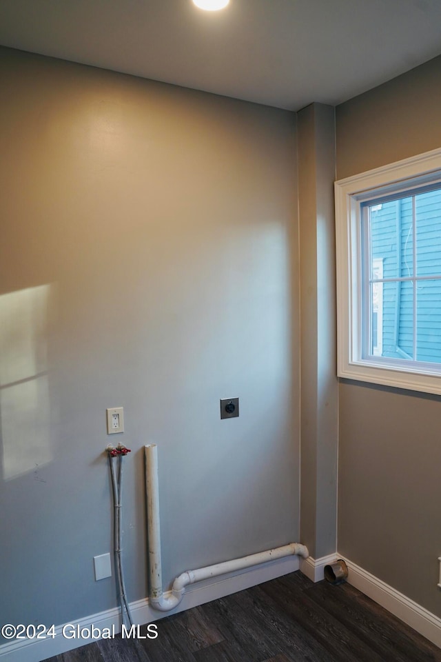 clothes washing area featuring washer hookup, hookup for an electric dryer, and dark hardwood / wood-style flooring