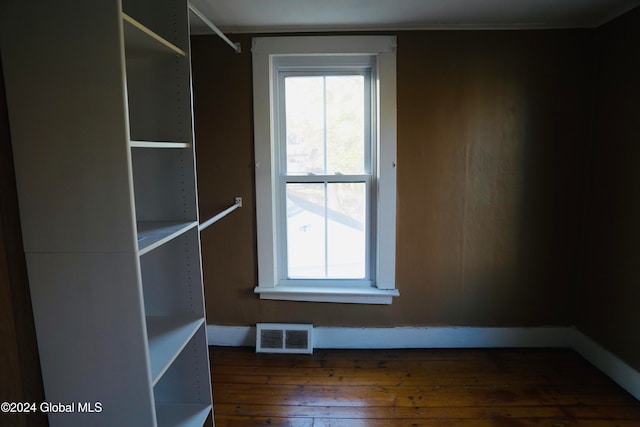 empty room with dark hardwood / wood-style floors