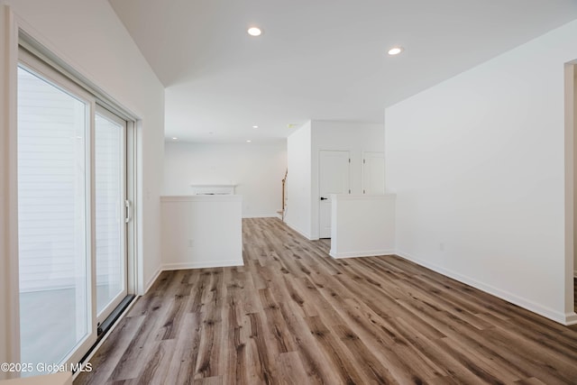 empty room featuring plenty of natural light and light hardwood / wood-style floors