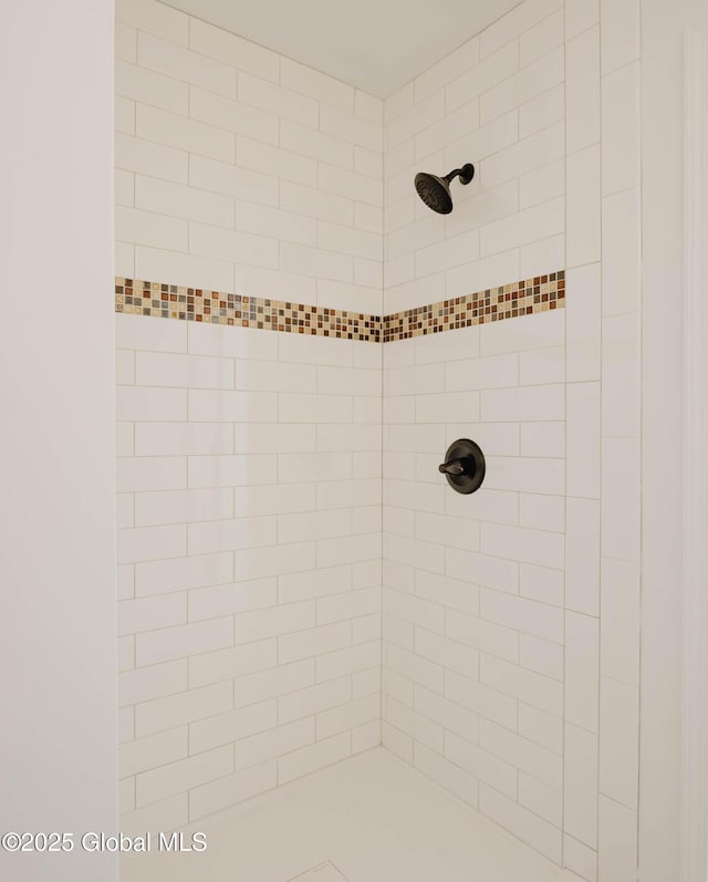 bathroom with a tile shower