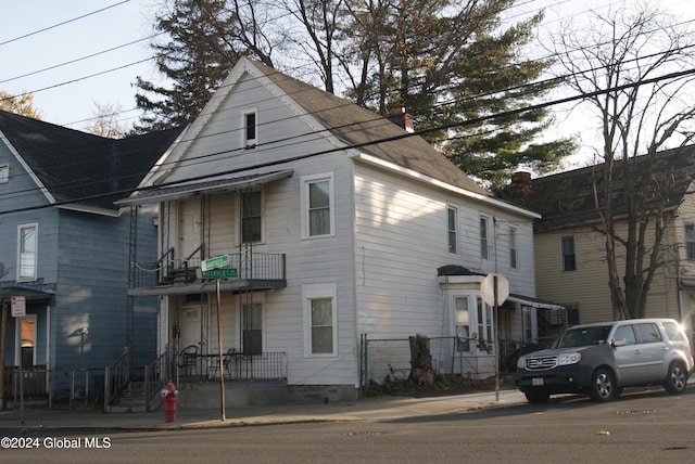 view of front of property with a balcony