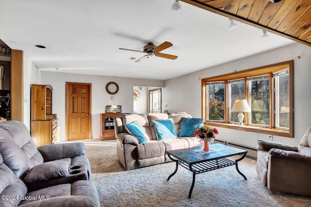 living room featuring light carpet, a baseboard radiator, and ceiling fan