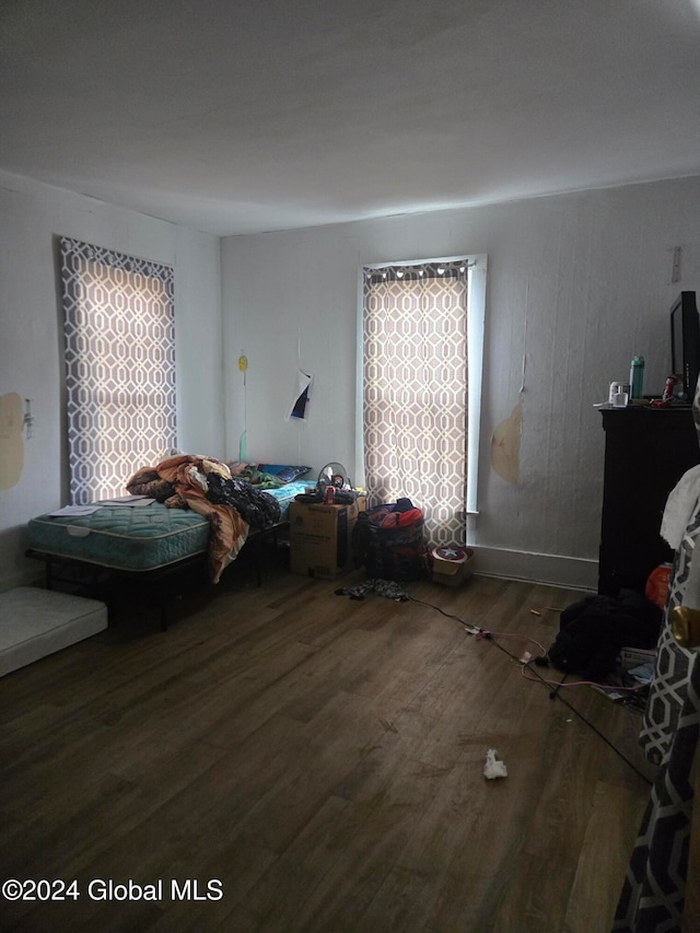 unfurnished bedroom with wood-type flooring