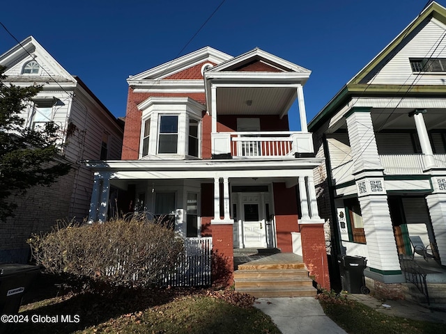 view of front of home with a balcony