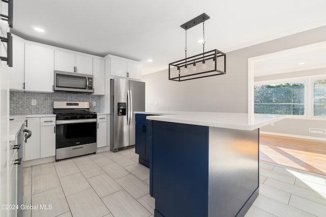 kitchen with white cabinetry, a kitchen island, and appliances with stainless steel finishes