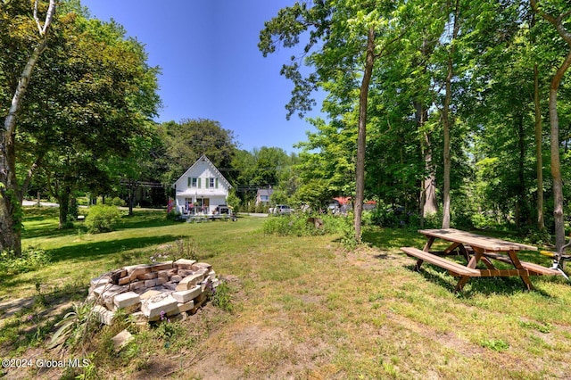 view of yard with an outdoor fire pit