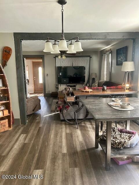 dining room featuring hardwood / wood-style flooring and a chandelier