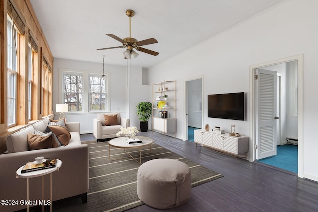 living room featuring ceiling fan, baseboard heating, and dark hardwood / wood-style flooring