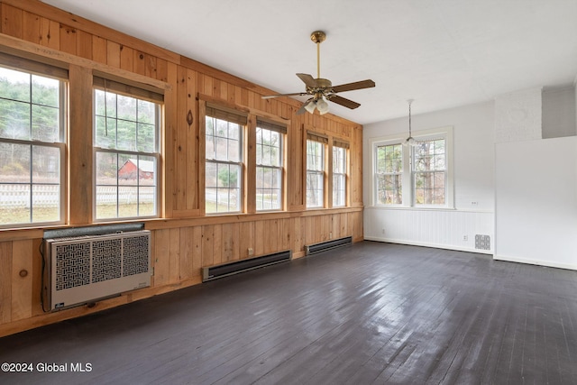 unfurnished sunroom with baseboard heating, plenty of natural light, and ceiling fan