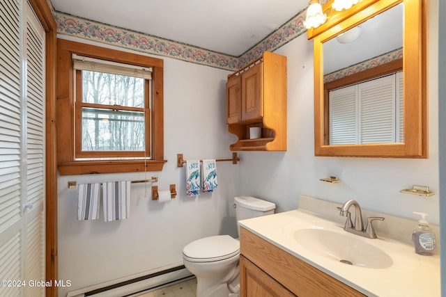 bathroom featuring vanity, a baseboard radiator, and toilet