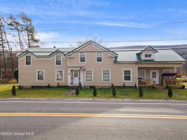 16 Main St, Worcester, NY 12064 - townhome / multi-family property with metal roof and a front lawn
