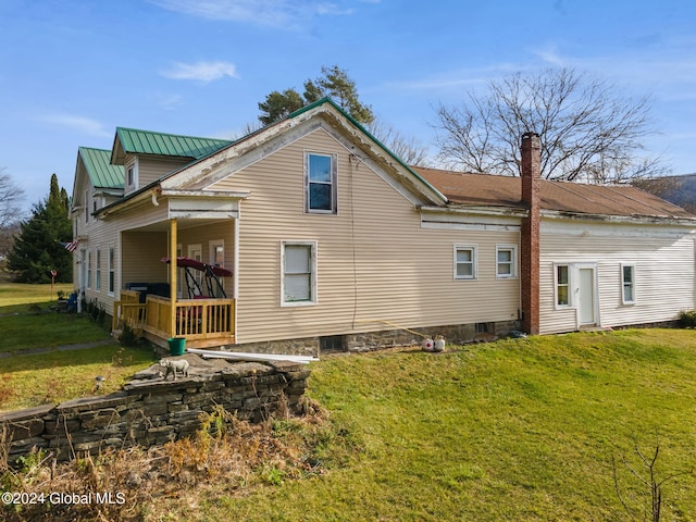 16 Main St, Worcester, NY 12064 - rear view of property featuring a yard and a chimney