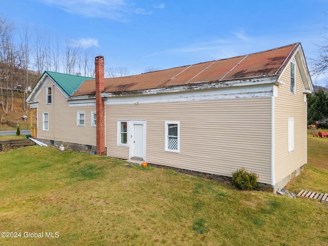 16 Main St, Worcester, NY 12064 - back of house with a chimney and a yard