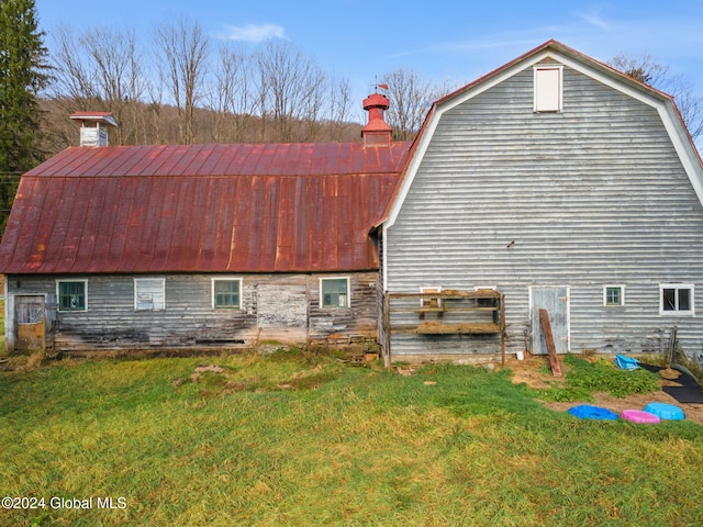 16 Main St, Worcester, NY 12064 - view of side of home with a gambrel roof, a barn, a lawn, and metal roof