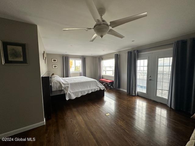 bedroom featuring french doors, dark hardwood / wood-style flooring, access to outside, and ceiling fan