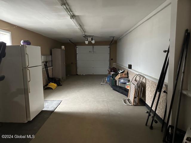 garage with white refrigerator