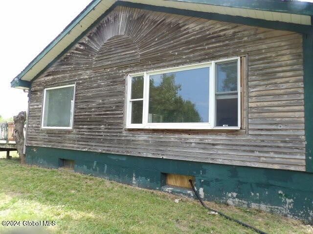 view of home's exterior featuring a lawn