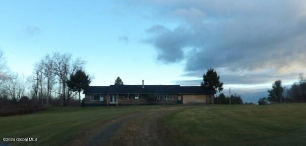 view of front of home with a front lawn