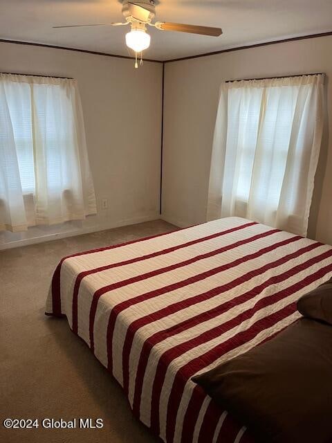 bedroom featuring carpet and ceiling fan