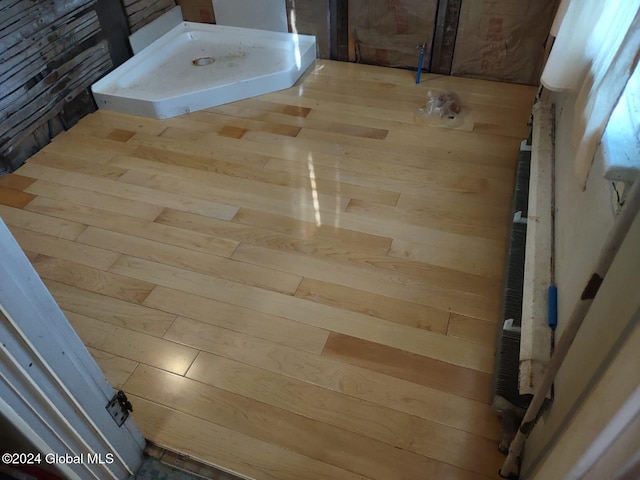 bathroom featuring wooden walls