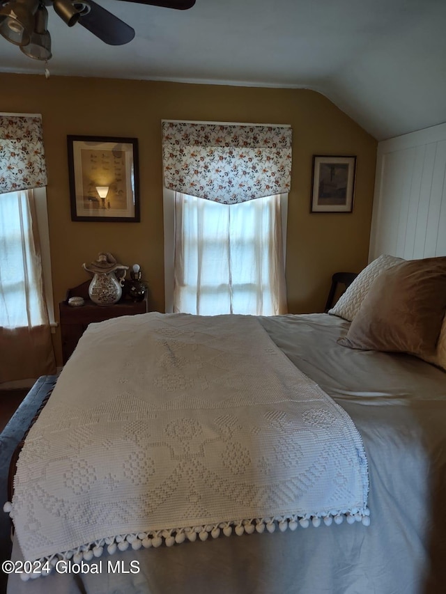 bedroom featuring ceiling fan and lofted ceiling