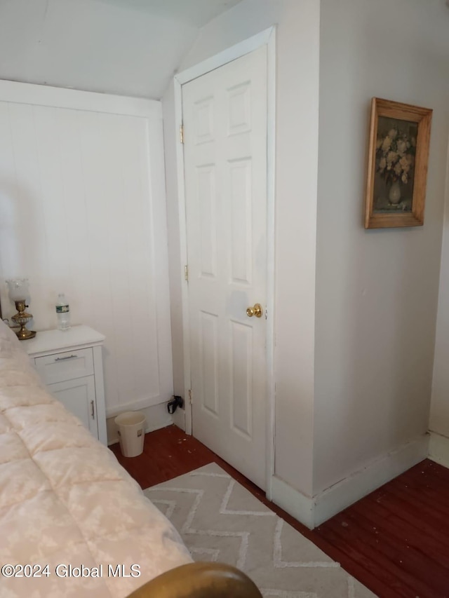 bedroom featuring vaulted ceiling and a closet