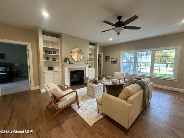 living room with hardwood / wood-style flooring and ceiling fan