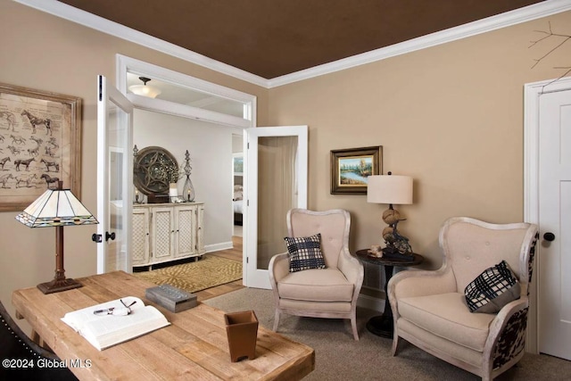 living area with carpet flooring and ornamental molding