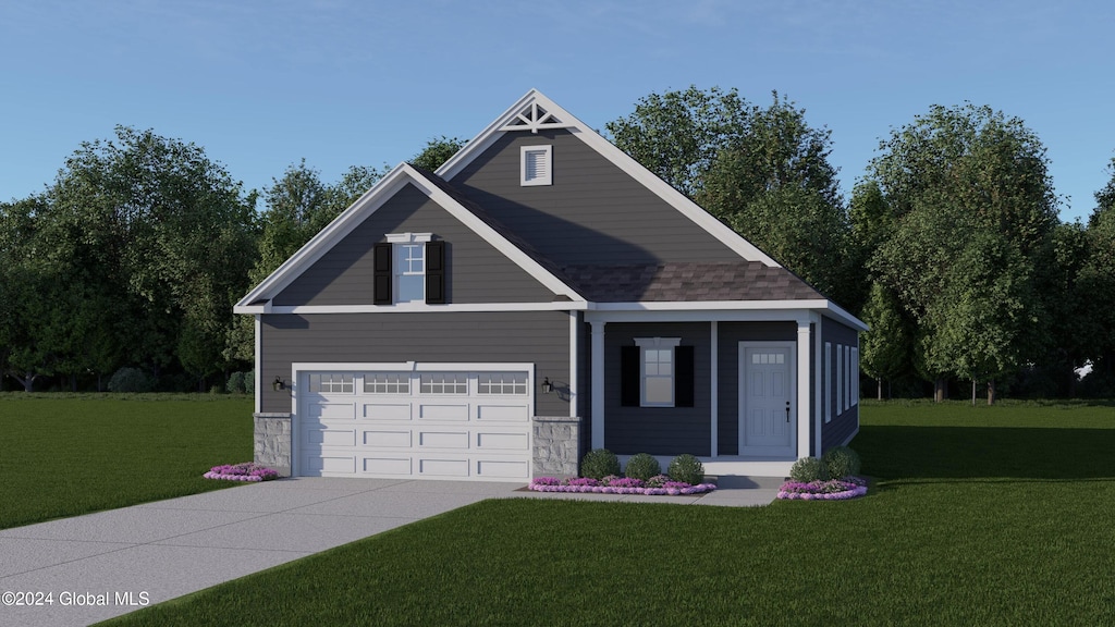 view of front of home featuring a front yard and a garage