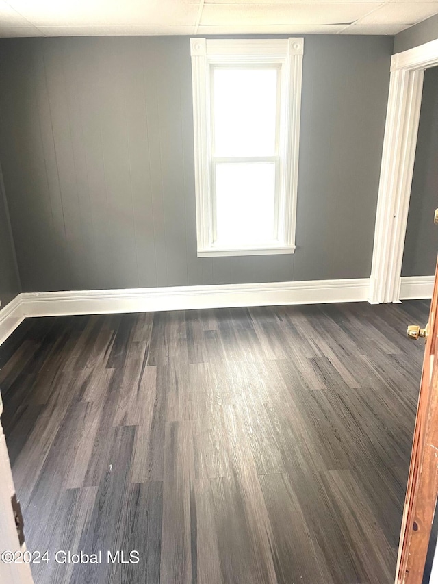 unfurnished room with dark hardwood / wood-style floors