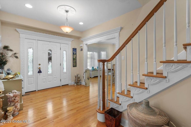 entrance foyer featuring light wood-type flooring and a wealth of natural light