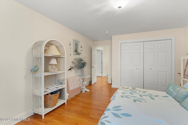 bedroom featuring hardwood / wood-style flooring and a closet