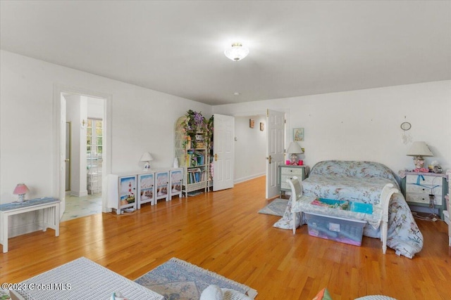 bedroom with hardwood / wood-style flooring