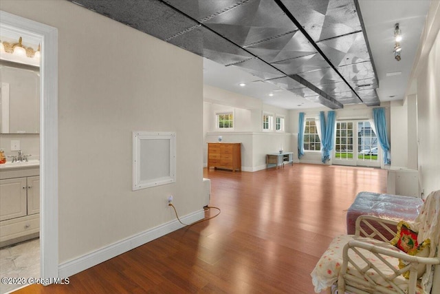 unfurnished room with light hardwood / wood-style flooring and sink