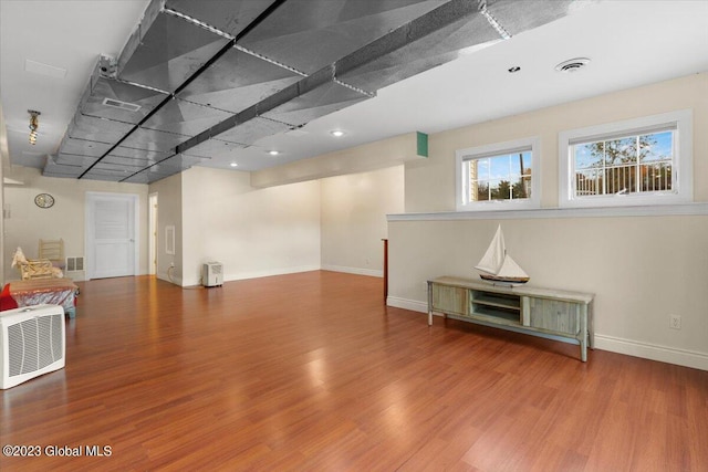 unfurnished room featuring hardwood / wood-style floors