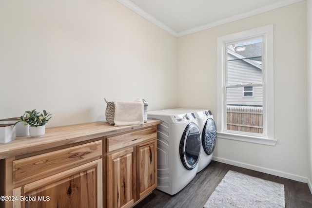 laundry area with cabinets, dark hardwood / wood-style flooring, ornamental molding, and washing machine and dryer