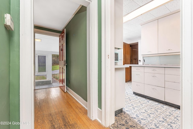 hallway with light hardwood / wood-style flooring