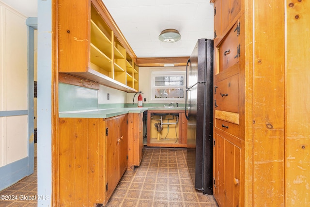 kitchen with black fridge and sink