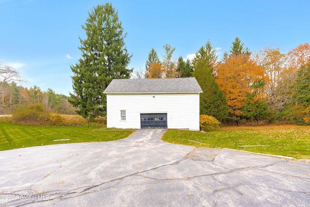 garage featuring a yard