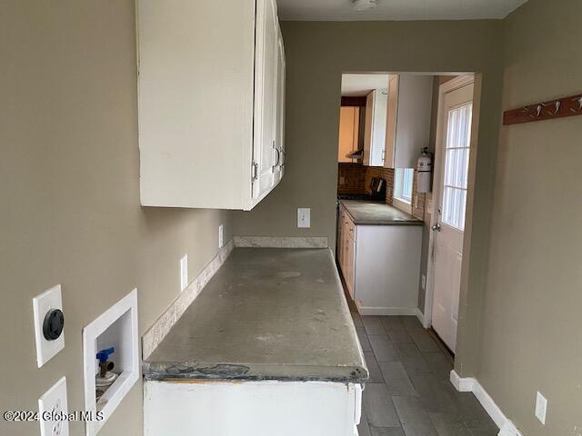 kitchen featuring white cabinets