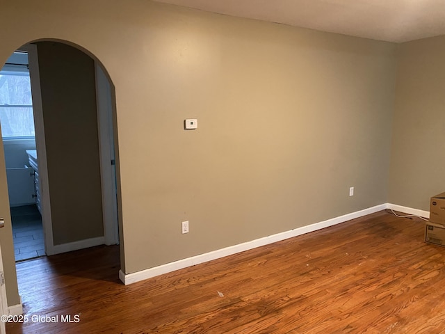 empty room with hardwood / wood-style floors