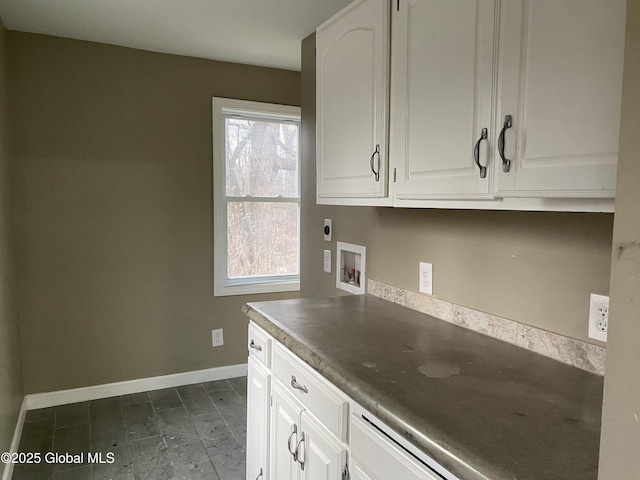 kitchen featuring white cabinetry