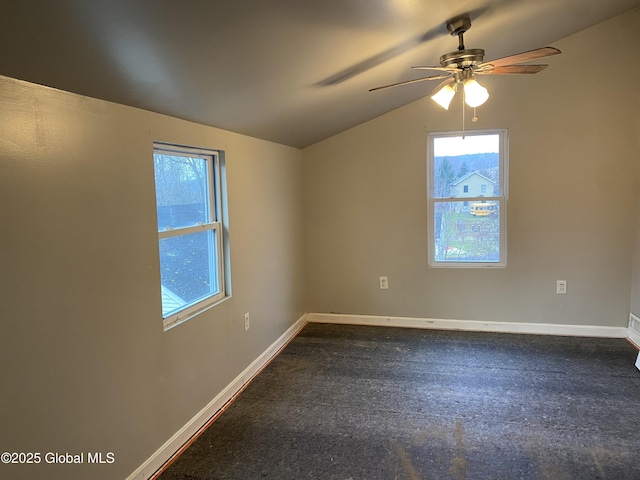 unfurnished room featuring ceiling fan and vaulted ceiling