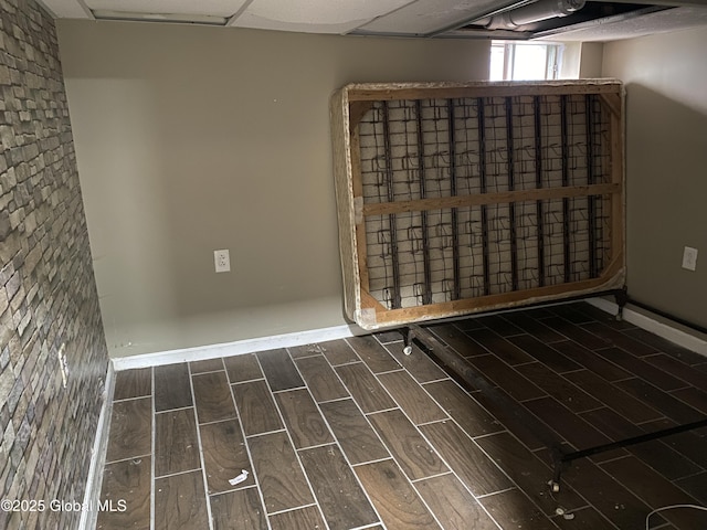 spare room with a paneled ceiling