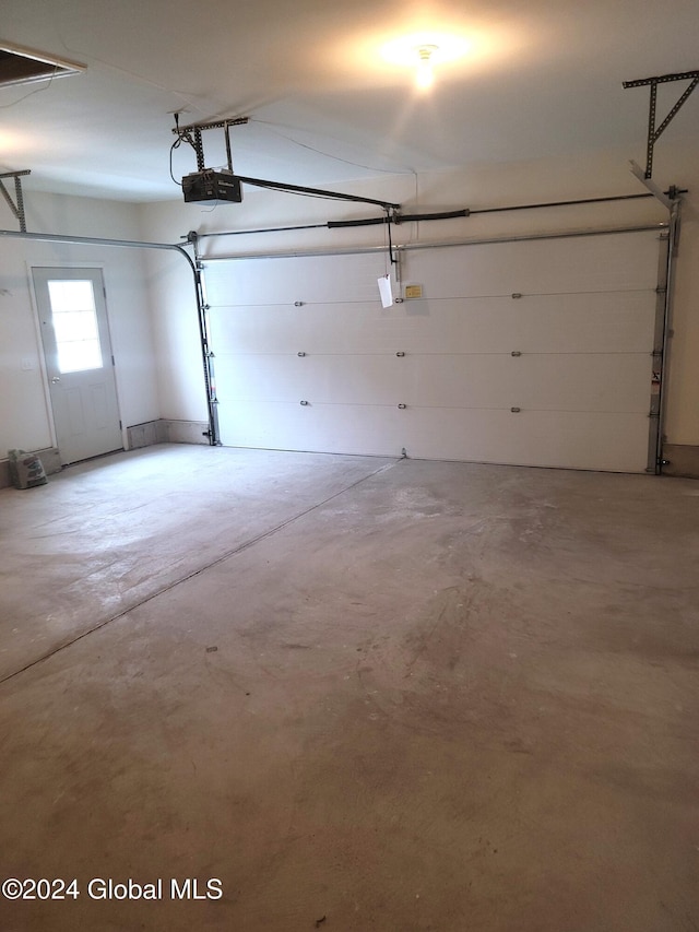 garage featuring a garage door opener