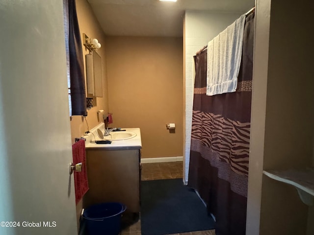 bathroom featuring tile patterned flooring and vanity